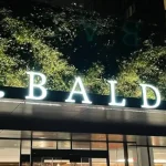 Picture of the C. Baldwin Hotel sign above the hotel entrance.